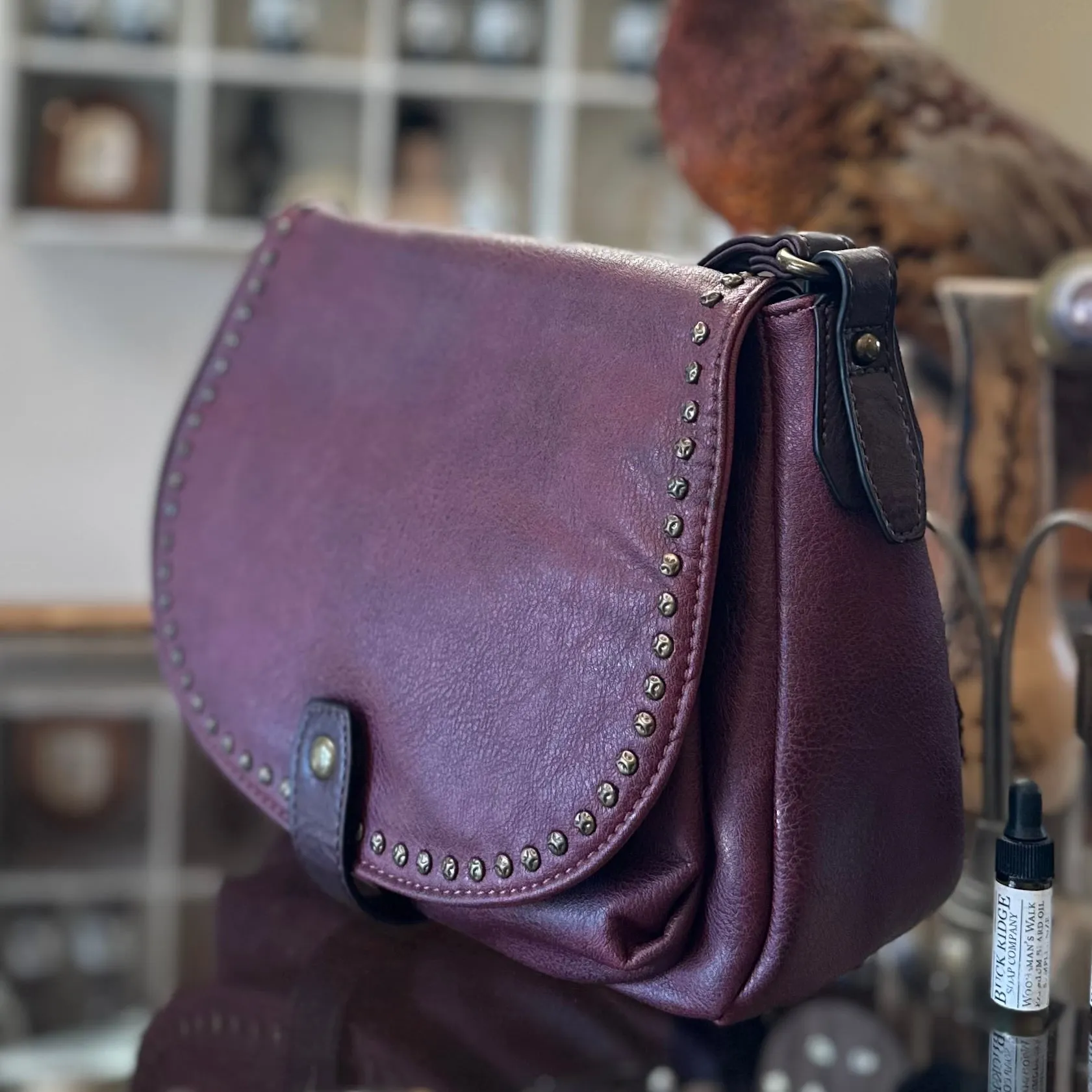 The CHEYENNE Burgundy Studded Front Flap Shoulder Bag